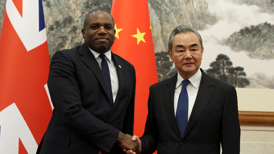 Foreign Secretary David Lammy and Chinese Foreign Minister Wang Yi shake hands