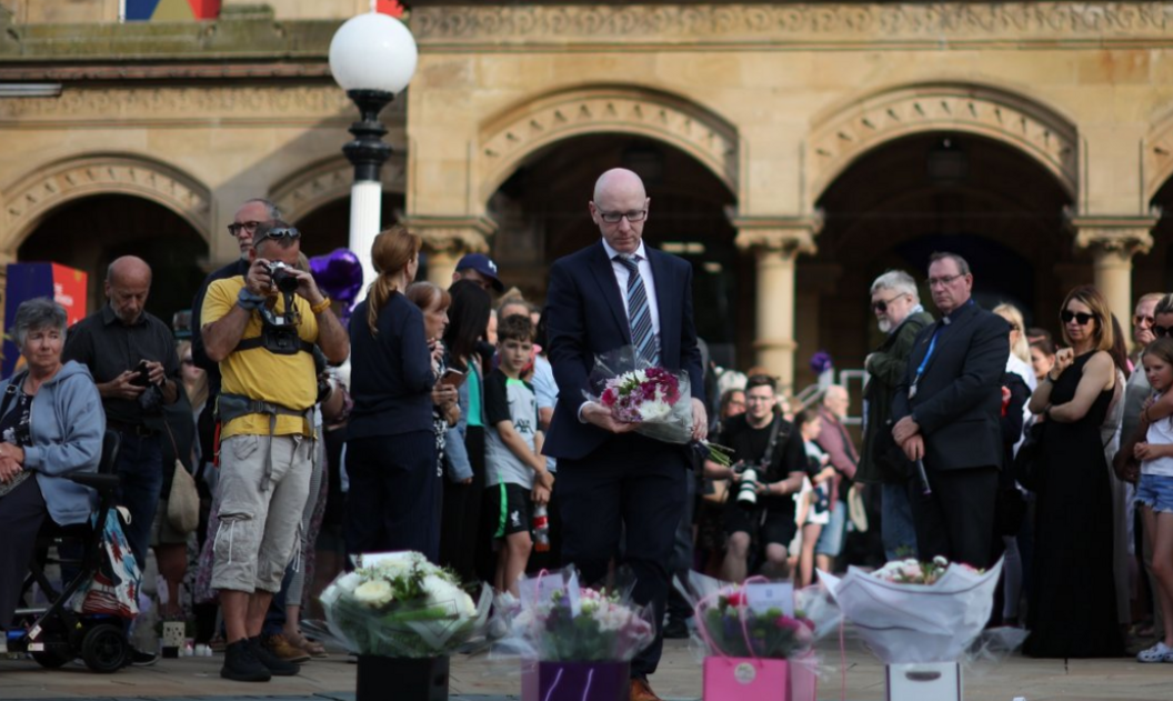 Southport MP Patrick Hurley lays flowers at a memorial to the victims of the Southport attack