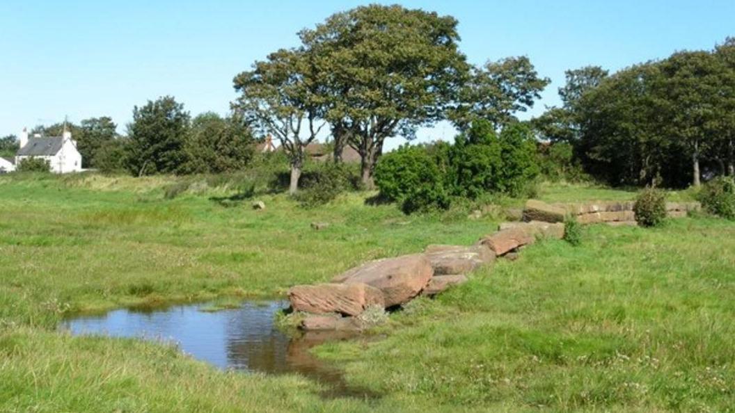 The remains of a sandstone wall on what is now a field show the area where the colliery's 