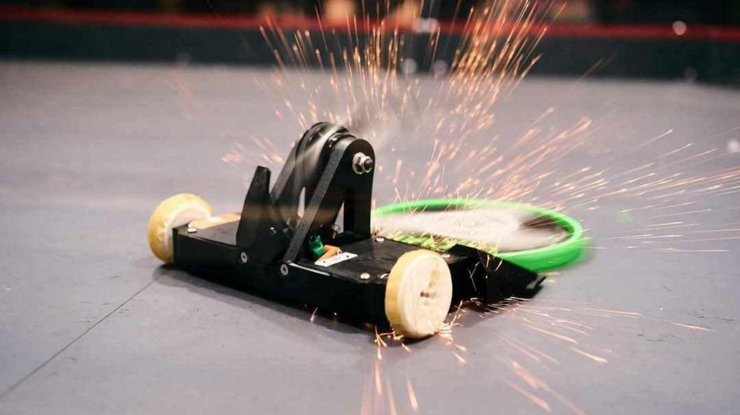 Sparks flying off two robots who are mid-battle with each other