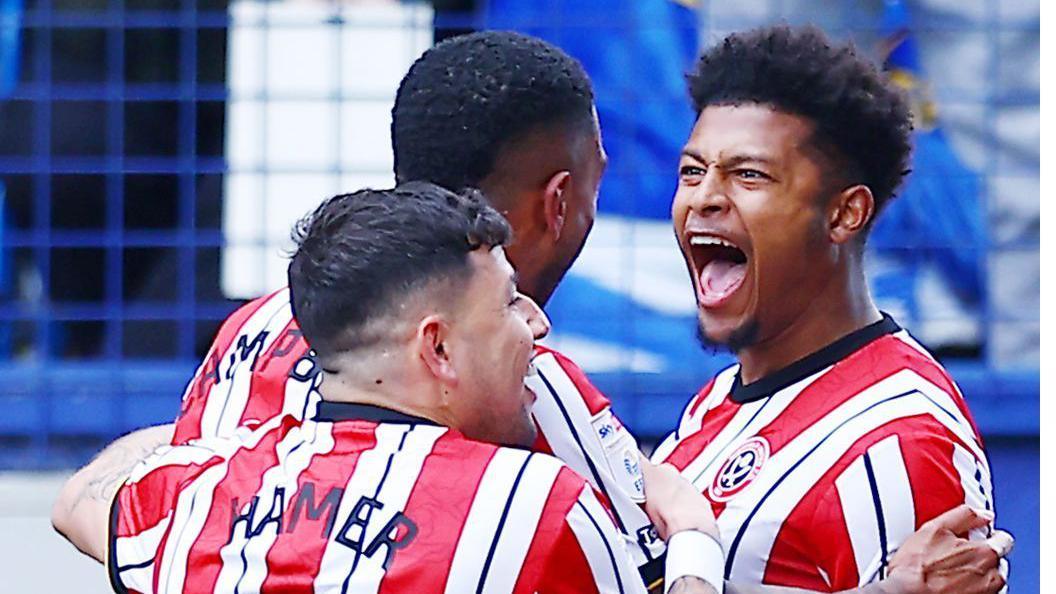 Sheffield United's Rhian Brewster (right) shouts in celebration after scoring, whil team-mates Gustavo Hamer and Tyrese Campbell congratulate him.