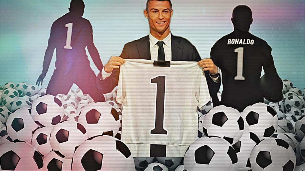 Ronaldo holding number one shirt.