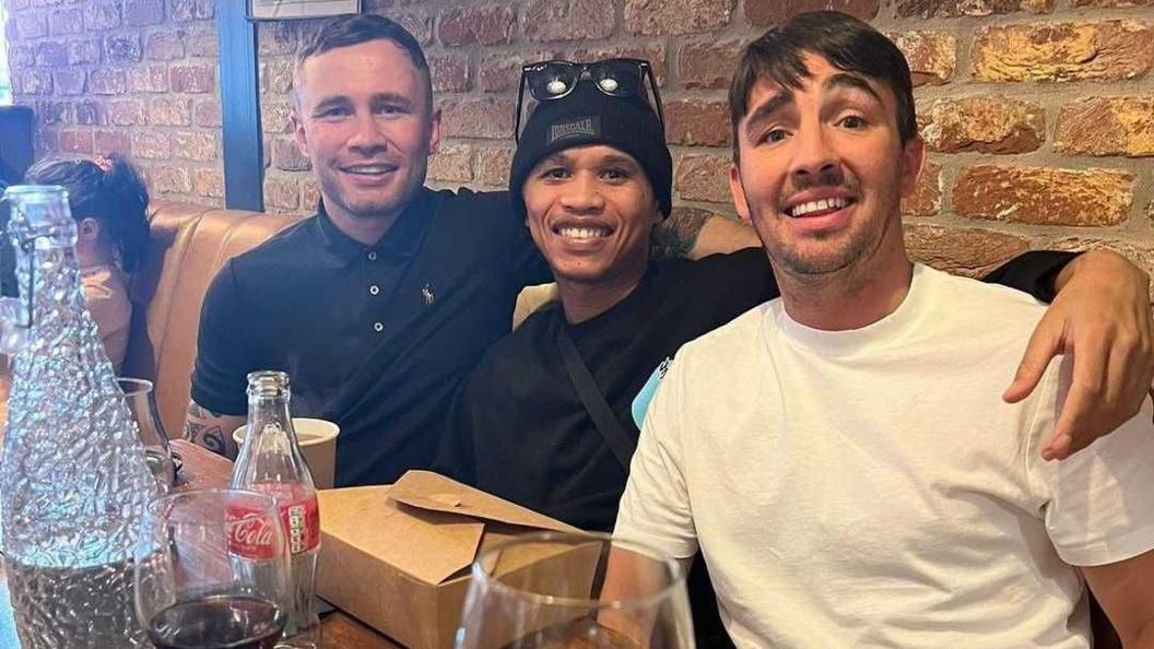 Ludumo Lamati with Jamie Conlan and Carl Frampton having a meal