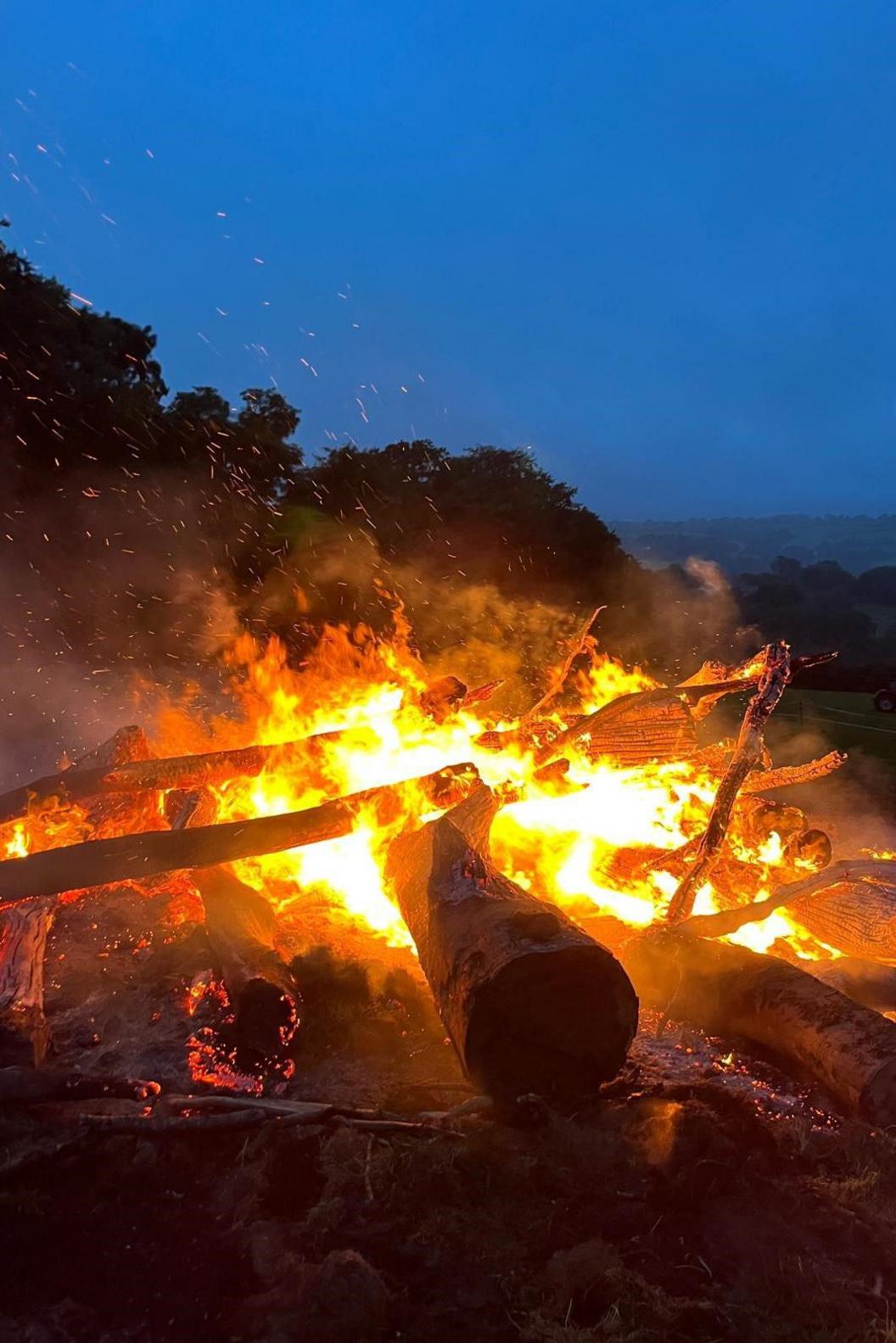 A bonfire burning at night time