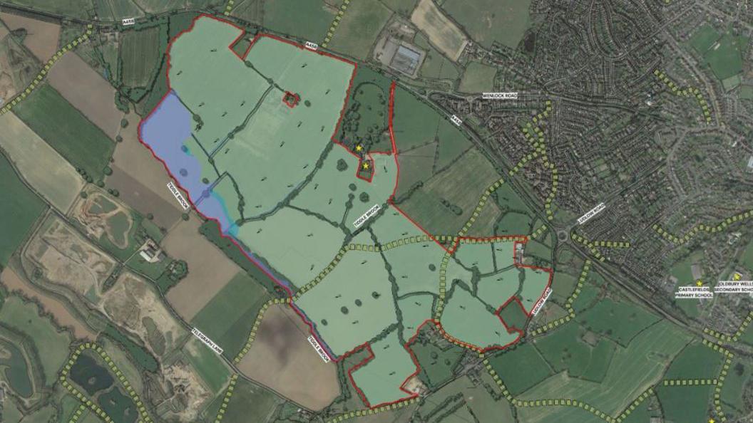 A plan of a proposed housing development with a green area marked out with a red outline to show where the homes would be built