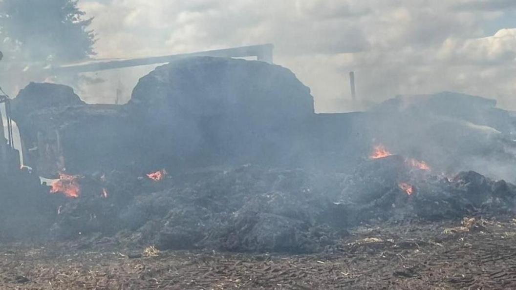 One of the trailers on fire in Stoke-by-Nayland