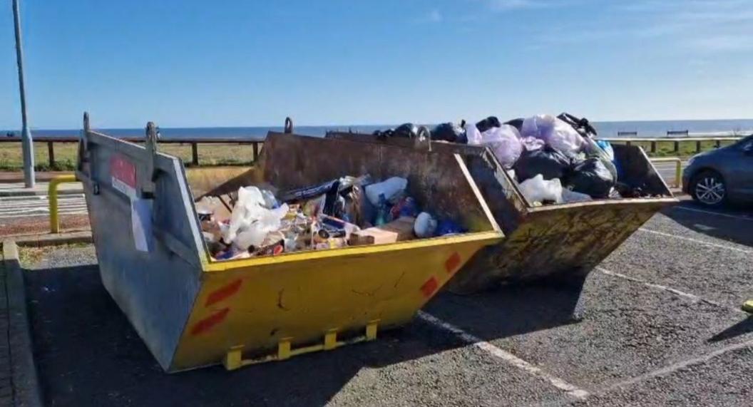 Skips containing rubbish at Whitburn car park 