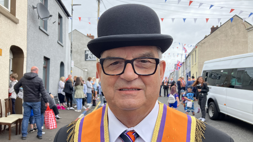 Victor Wray, from City of Londonderry Grand Orange Lodge in orange sash and bowler hat