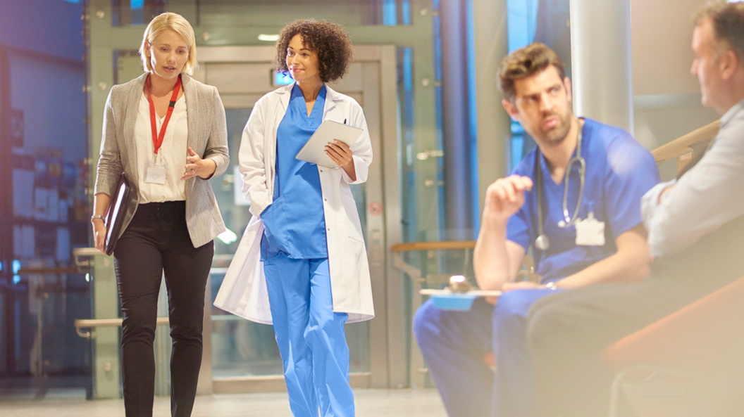 Hospital corridor with doctors talking