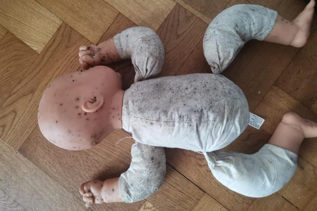 Doll covered in mould