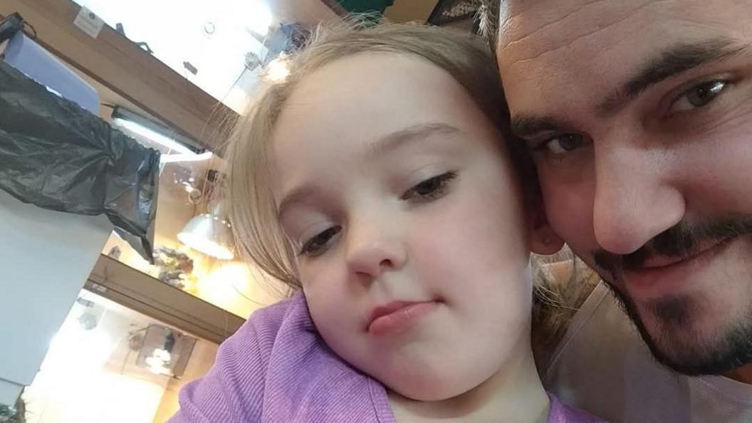 Gareth Costellow and his daughter as they look after the animals at the centre.