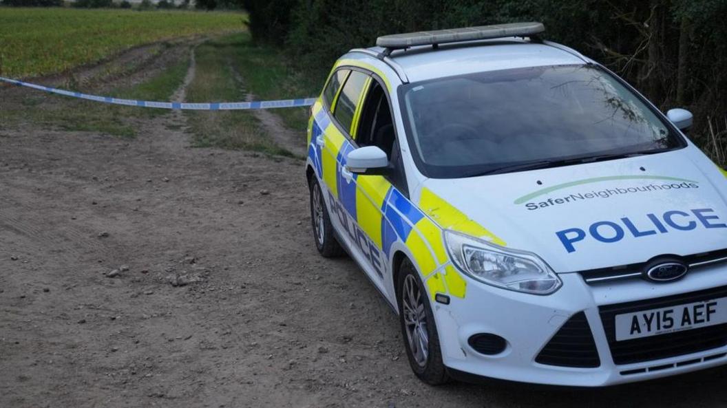 Police cordon and car in the Newmill Lane area of Brantham, Suffolk. 