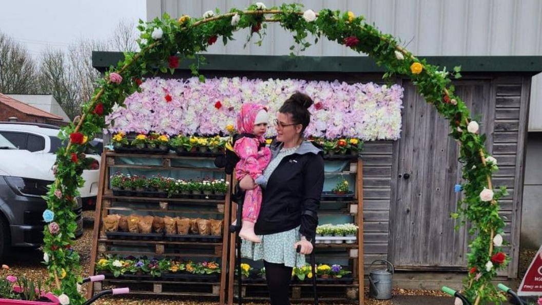 Bethany Barnes with her daughter in a play area 