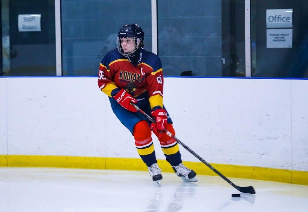 A Cambridge Kodiak player on the ice with a stick and putt