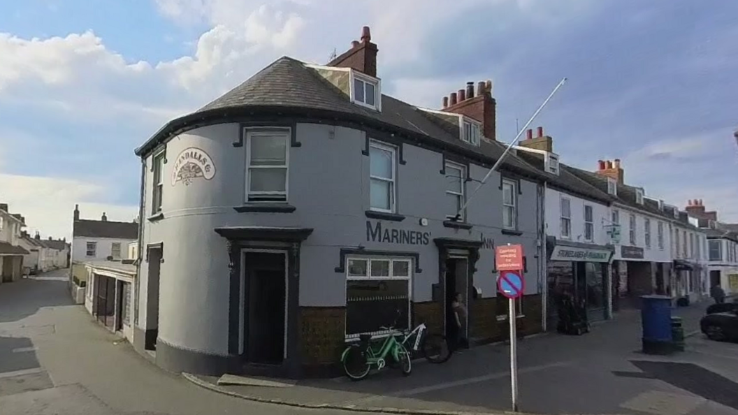 The grey painted Mariners Inn