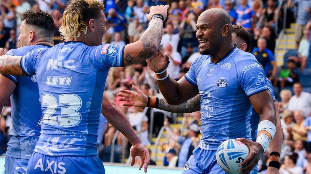 Leeds' Maika Sivo (right) celebrates scoring a try against Hull KR.