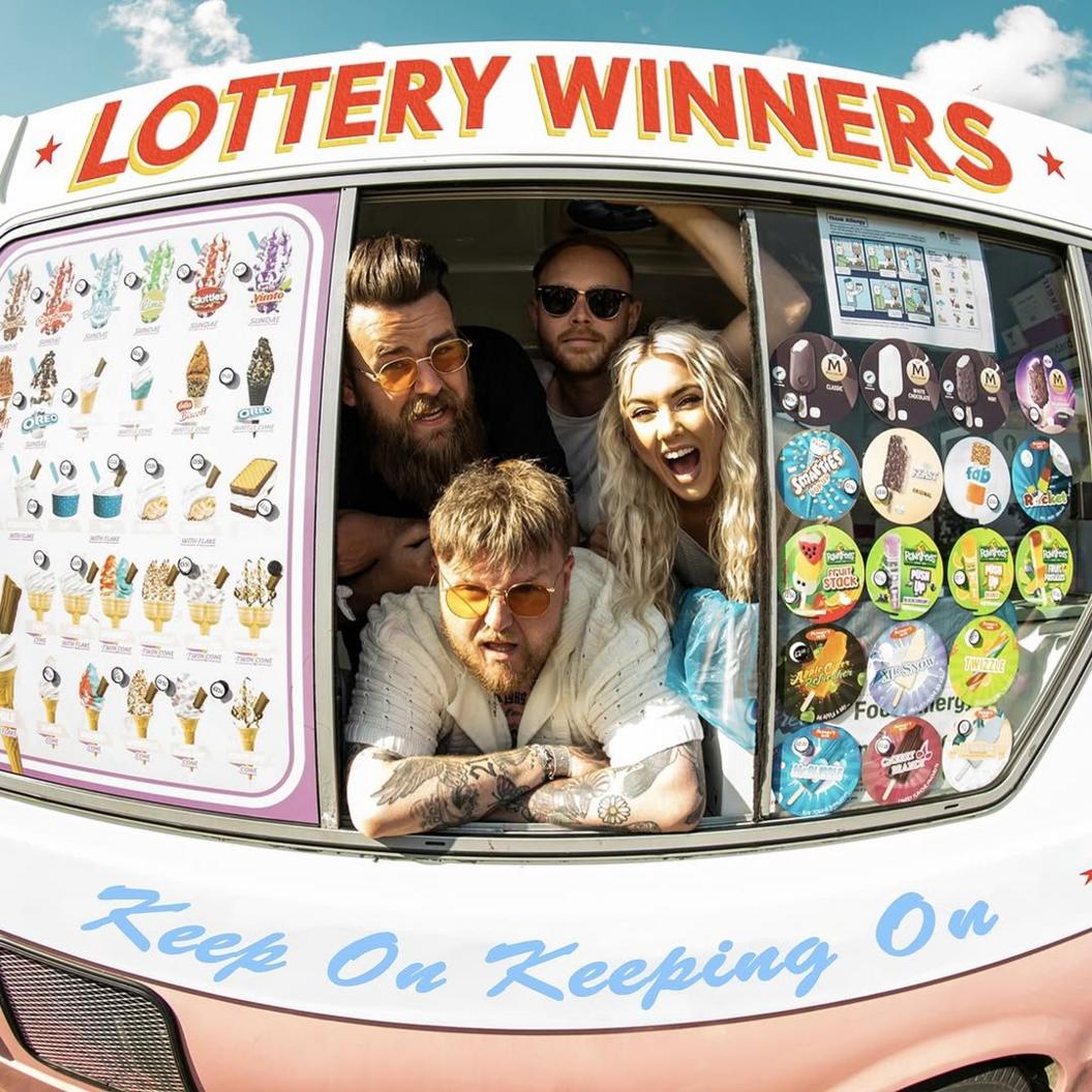 Lottery Winners pose in the window of an ice cream van, which has been stencilled with the name of their new album, Keep On Keeping On