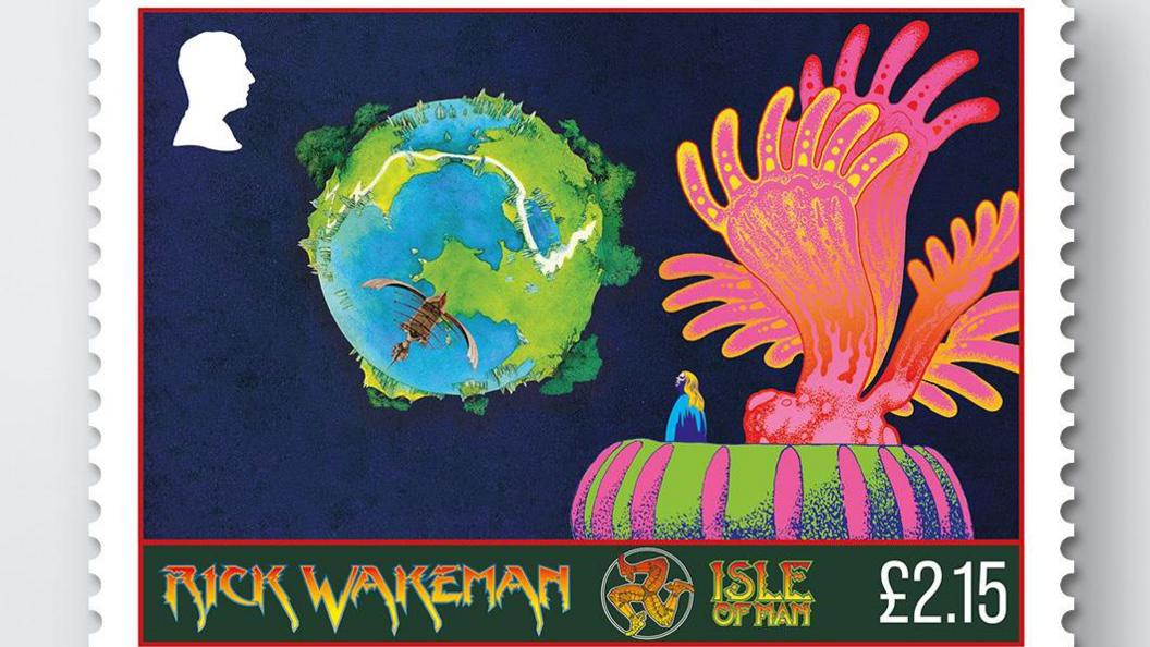 A stamp featuring an illustration of the earth on a dark blue background with Wakeman looking up from an elaborate colourful stge.