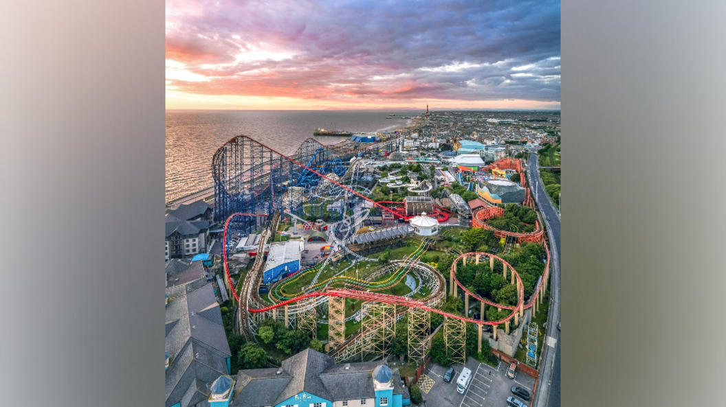 An aerial picture which shows various rollercoasters from the sky along a promenade 