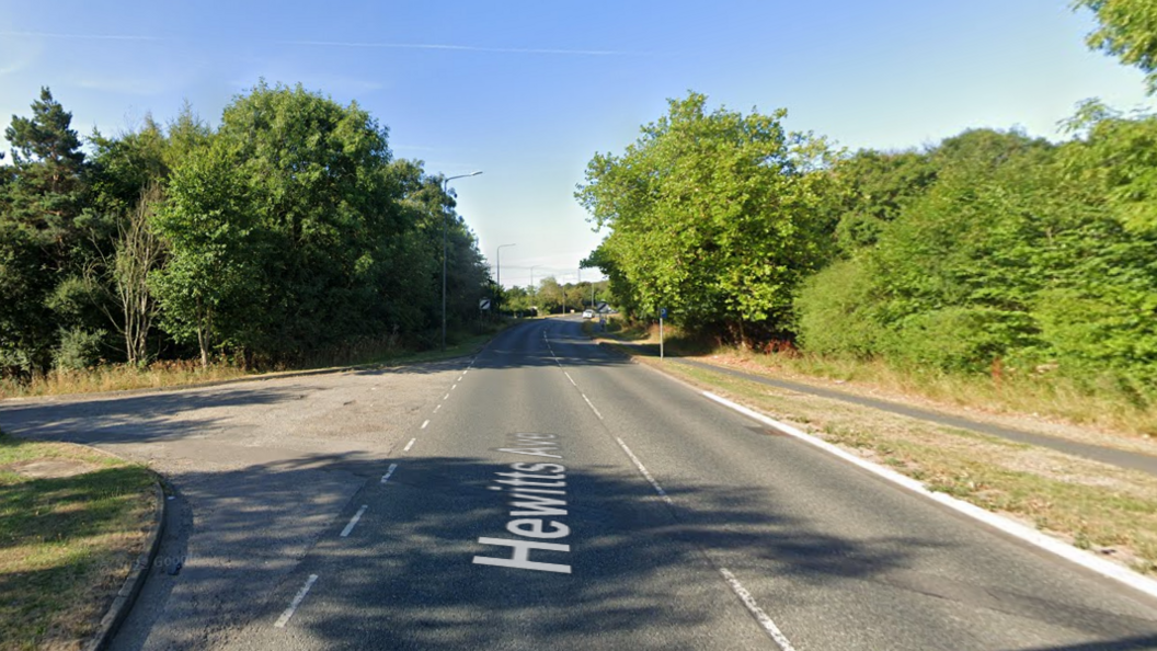 a sunny summers day on Hewitts Avenue, with a no restriction speed sign in the distance.