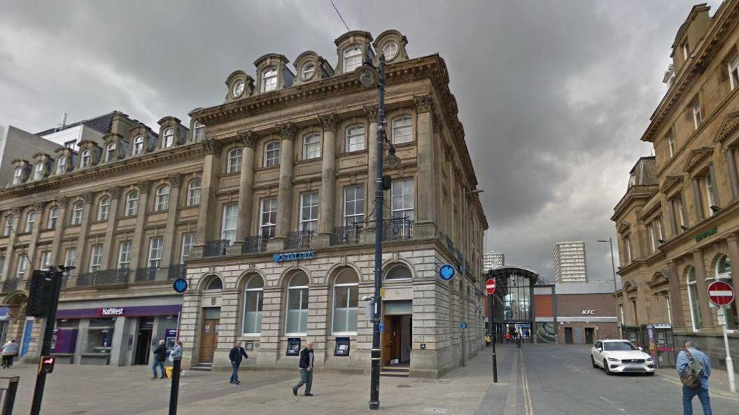 Street view of Barclays Bank in Sunderland. It is a four-storey, period building, featuring columns and ornate windows