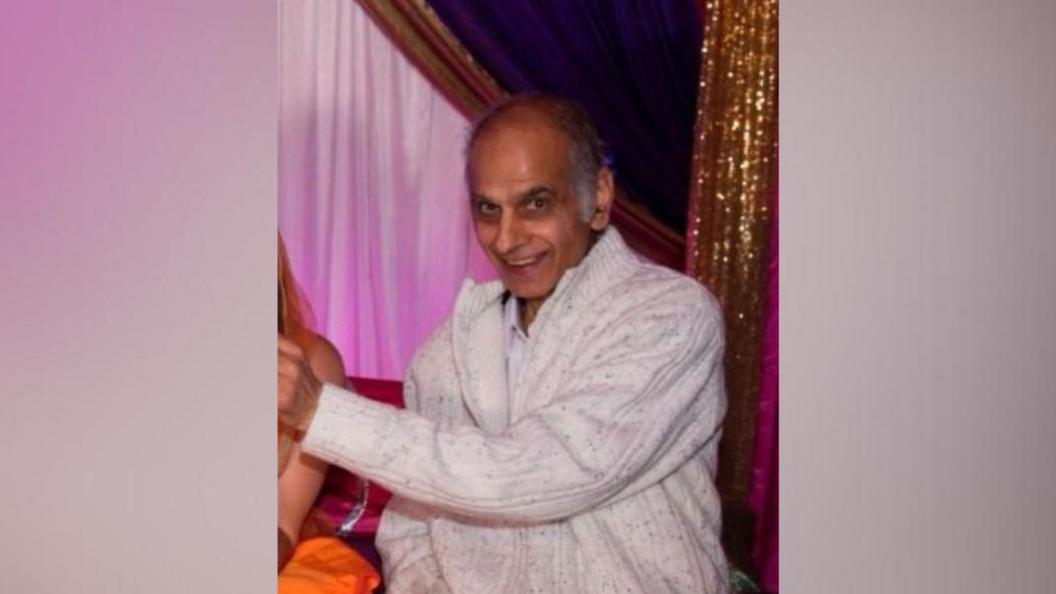 Bhim Kohli, wearing a white jumper, smiling