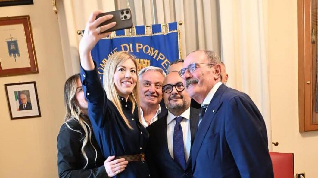 Gennaro Sangiuliano poses with Maria Rosaria Boccia and Italian officials