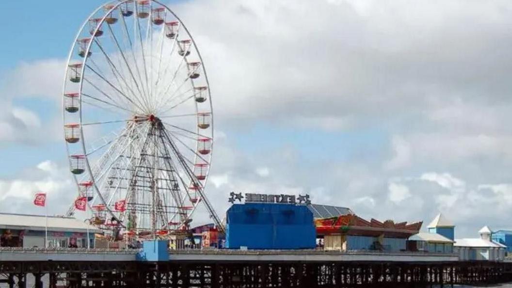 Blackpool's Central Pier featuring the Big Wheel and other funfair rides