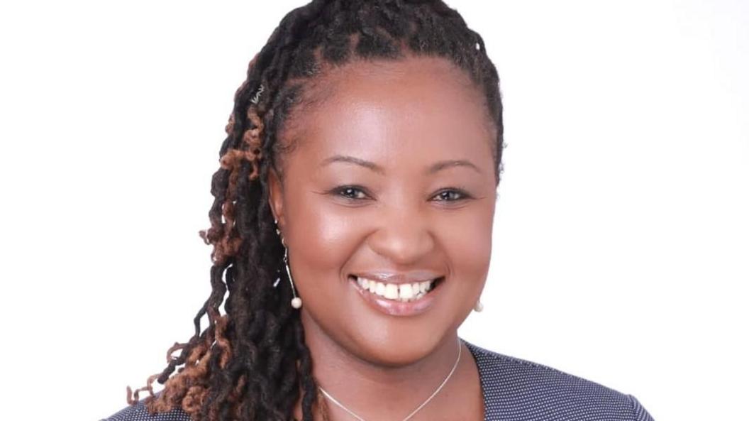 Marianne Kilonzi is seen from the shoulders up against a white background.