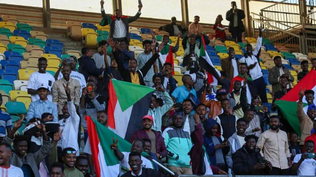 Sudan supporters breaking flags in the stands of a stadium in Benghazi Libya