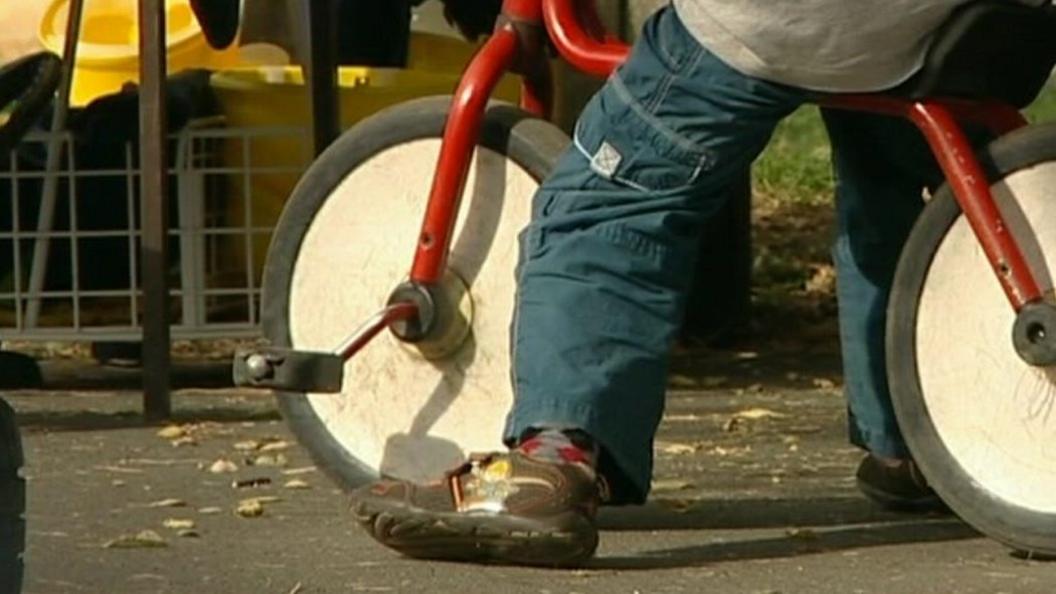 Child and bicycle