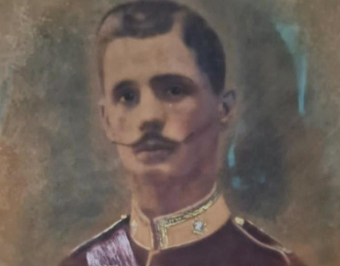 A painted portrait showing a man with short dark hair and a moustache in a military uniform.