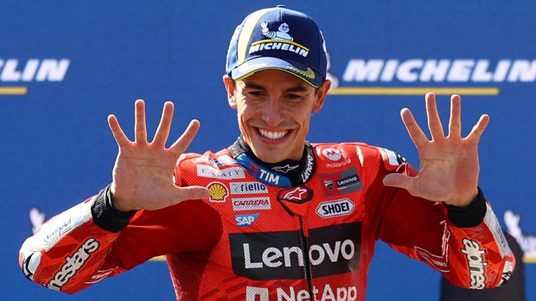 MotoGP rider Marc Marquez smiling connected nan podium aft winning nan 2025 Hungarian Grand Prix