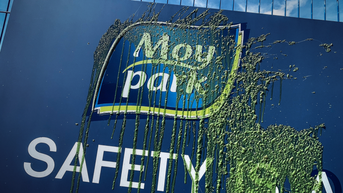 Sign with a "Moy Park" logo covered in green sludge