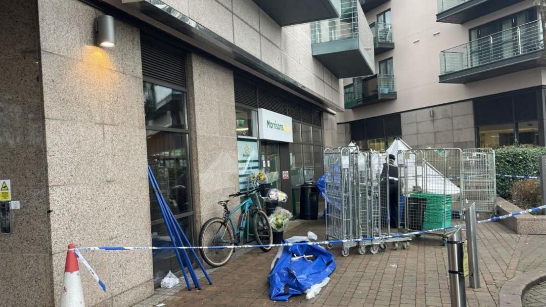 Morrisons with a police tent erected outside