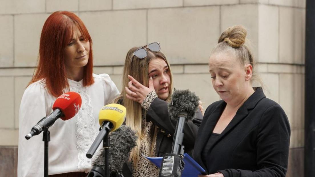 Det Insp Claire McGarvey (far left) with red hair and white top, beside Leanne Rowlands with long blonde hair and glasses (centre) and Cheryl Burns (right) in dark suit with blonde hair worn up.