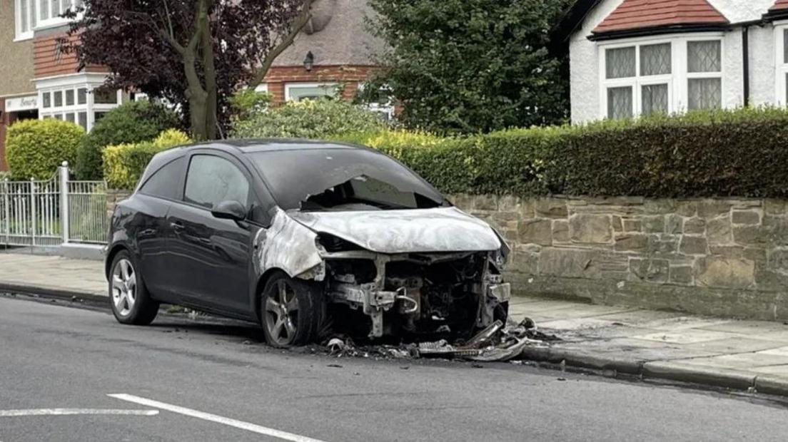 One of the burnt cars in August last year