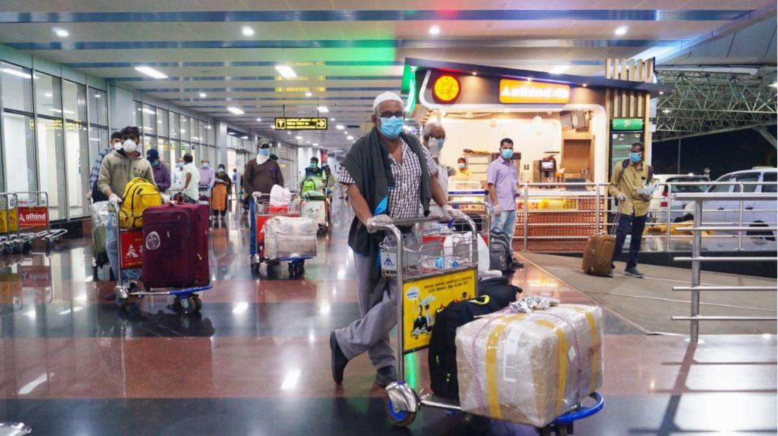 Evacuees from Dubai arrive at the Calicut airport in Kerala