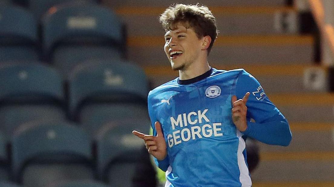 Gustav Lindgren celebrates after scoring for Peterborough in the EFL Trophy