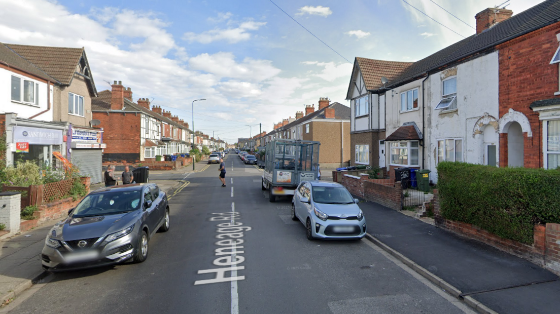 A google maps image looking down Heneage towards the junction where the collision happened. It is a residential street with some local shops on the corner of the junction.