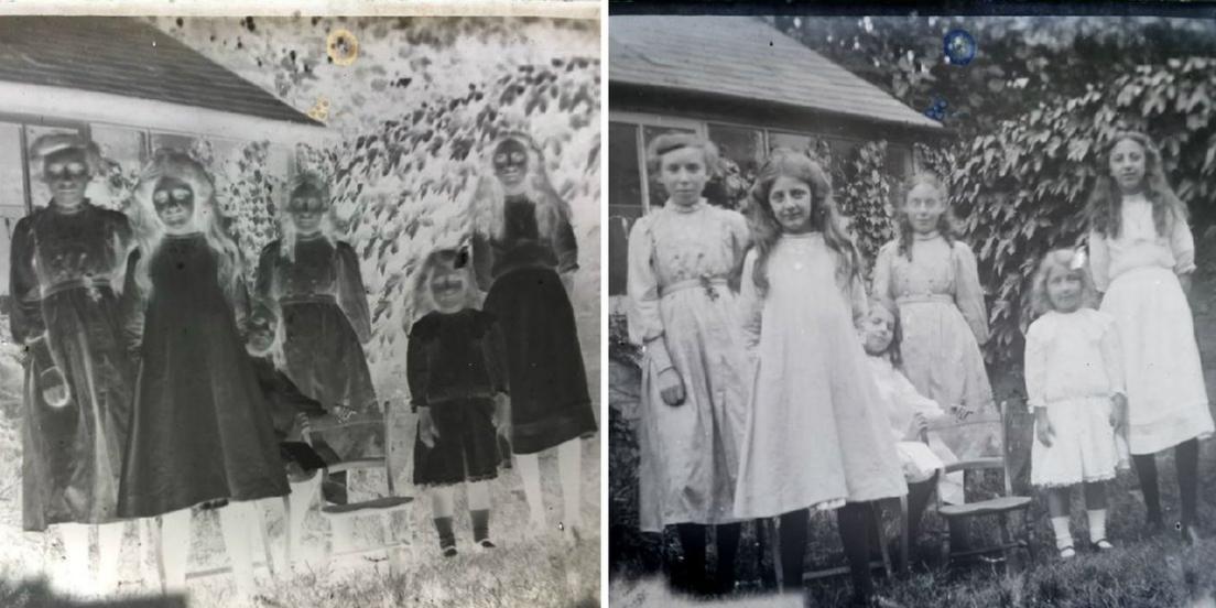 Children wearing white dresses and flower garlands smile at the camera