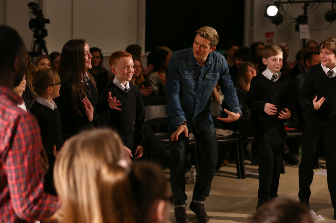 Orlando Bloom performing with drama students in Stockport