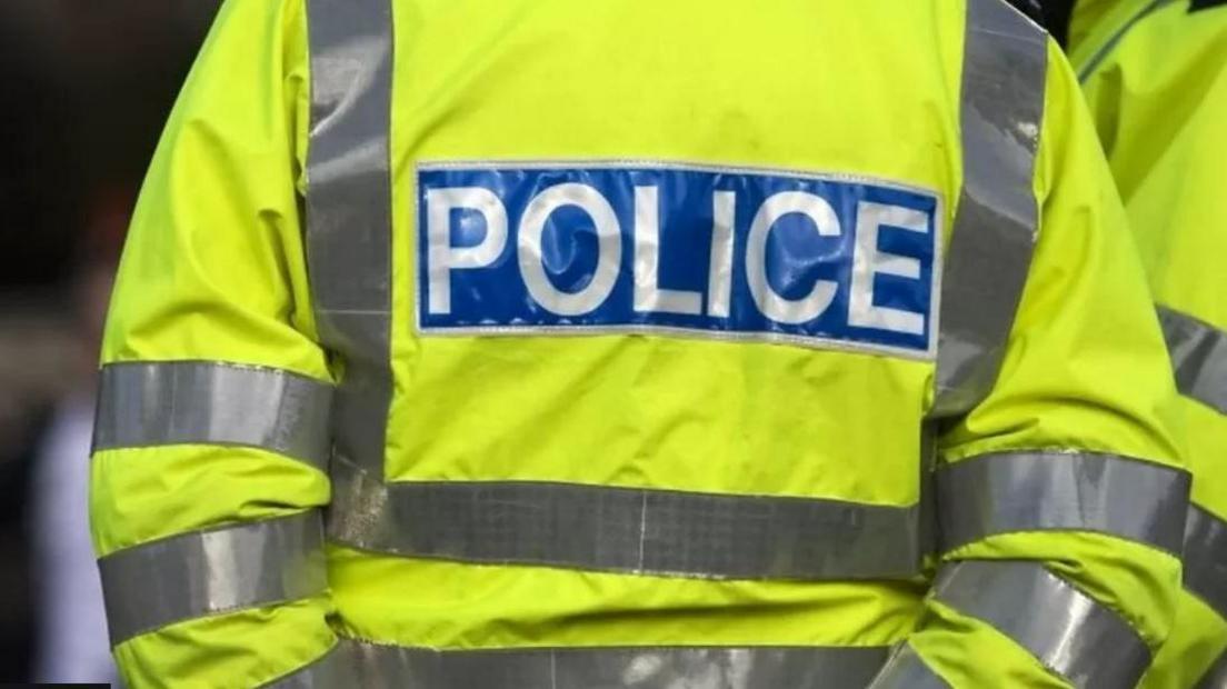 Close up shot of a police hi vis jacket 