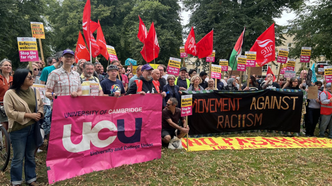 People gathered for the protest with flags and banners 