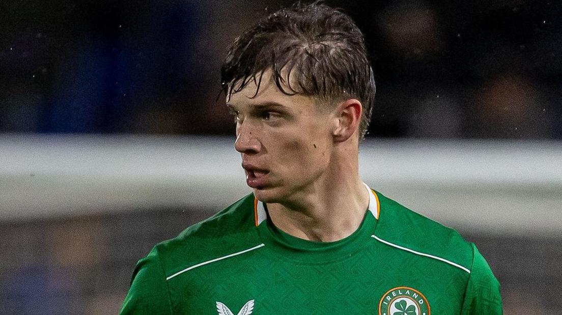 Conor McManus playing for Republic of Ireland Under-21s on a rainy night