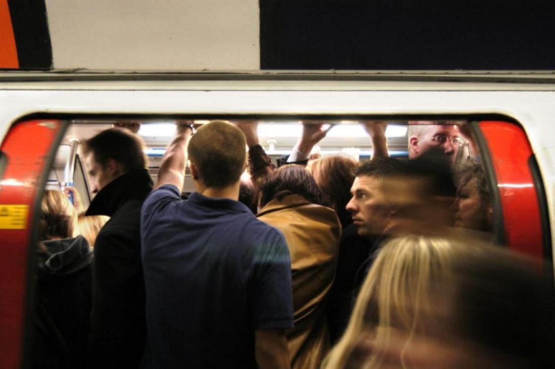 People getting on a tube train 