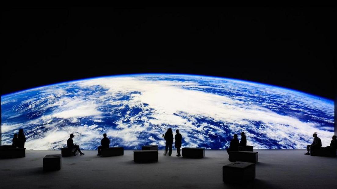 Planet Earth viewed from the moon by spectators at the show with special benches