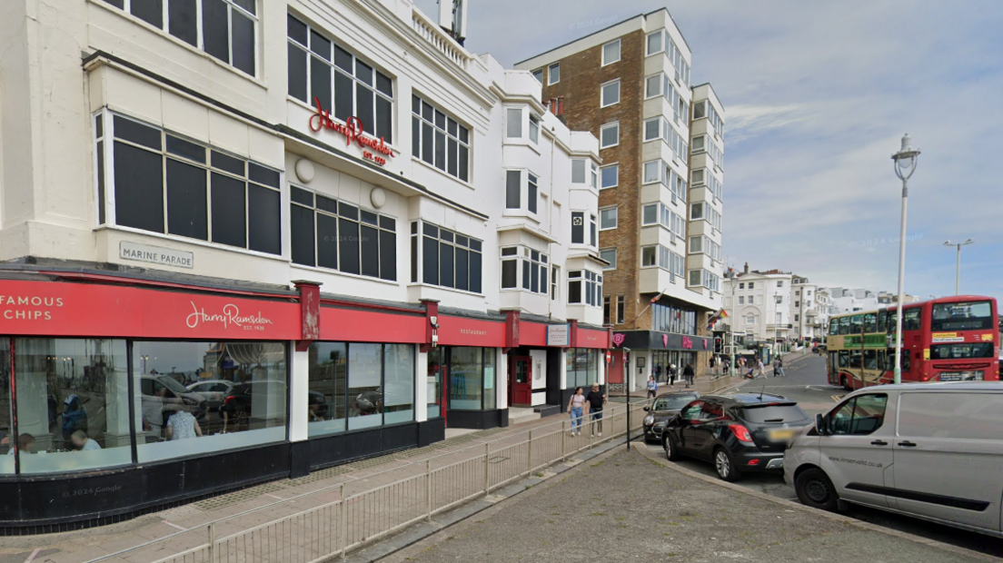 A Google streetview of Harry Ramsdens, a white building with a red storefront, on Brighton seafront.