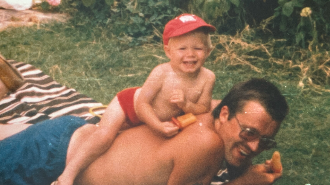 Lee sitting on Colin's back when he was a child