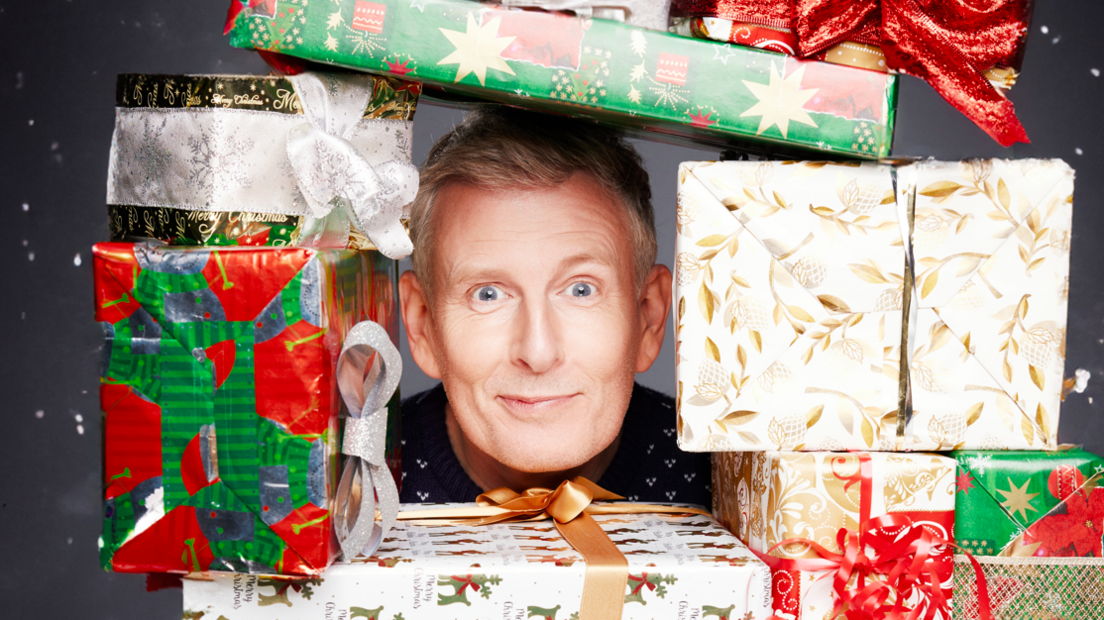 Patrick Kielty surrounded by presents